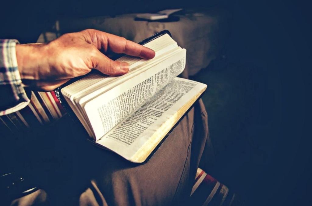 A man opens his Bible.